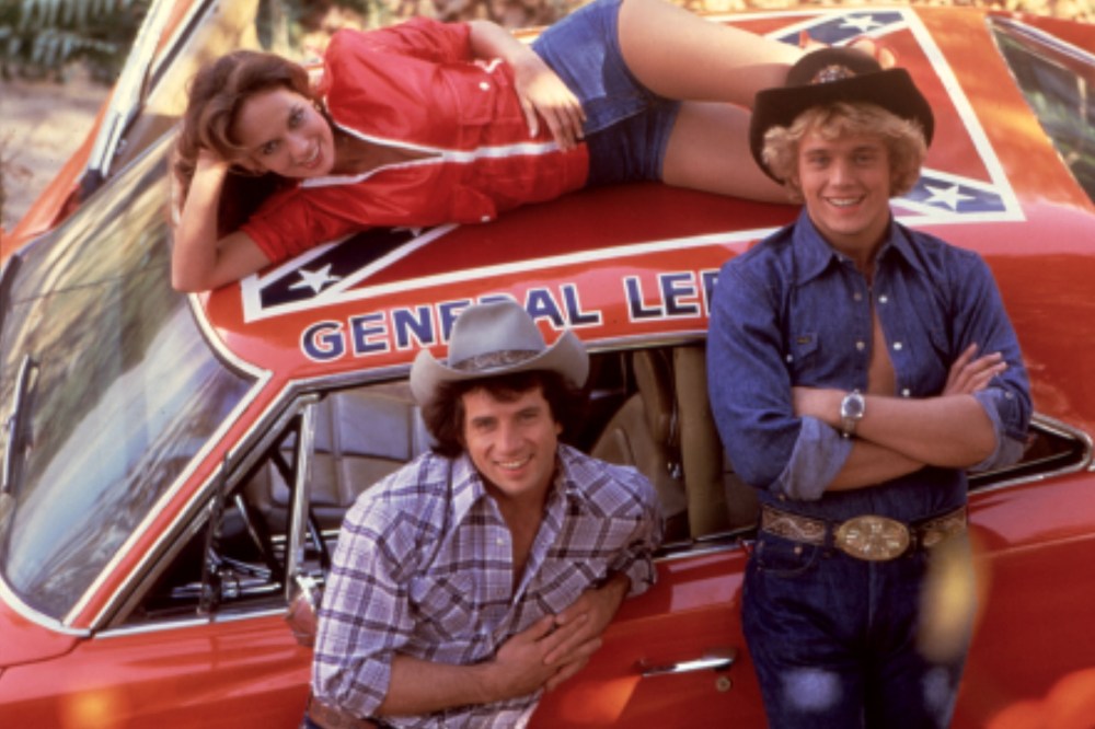 The Dukes Of Hazzard, Catherine Bach, Tom Wopat, John Schneider are seen with the famous General Lee car. (Photo by Moviestore Collection/Rex Features/AP)