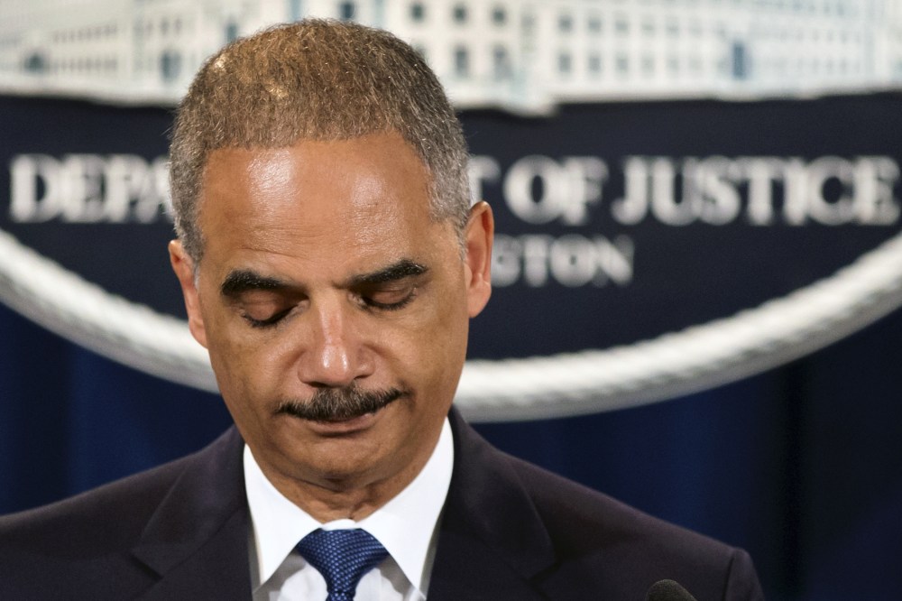 Attorney General Eric Holder expresses disappointment in the Supreme Court's 5-4 ruling in the Alabama voting rights case, Shelby County v. Holder, Tuesday, June 25, 2013, at the Justice Department in Washington. The court declared unconstitutional a...