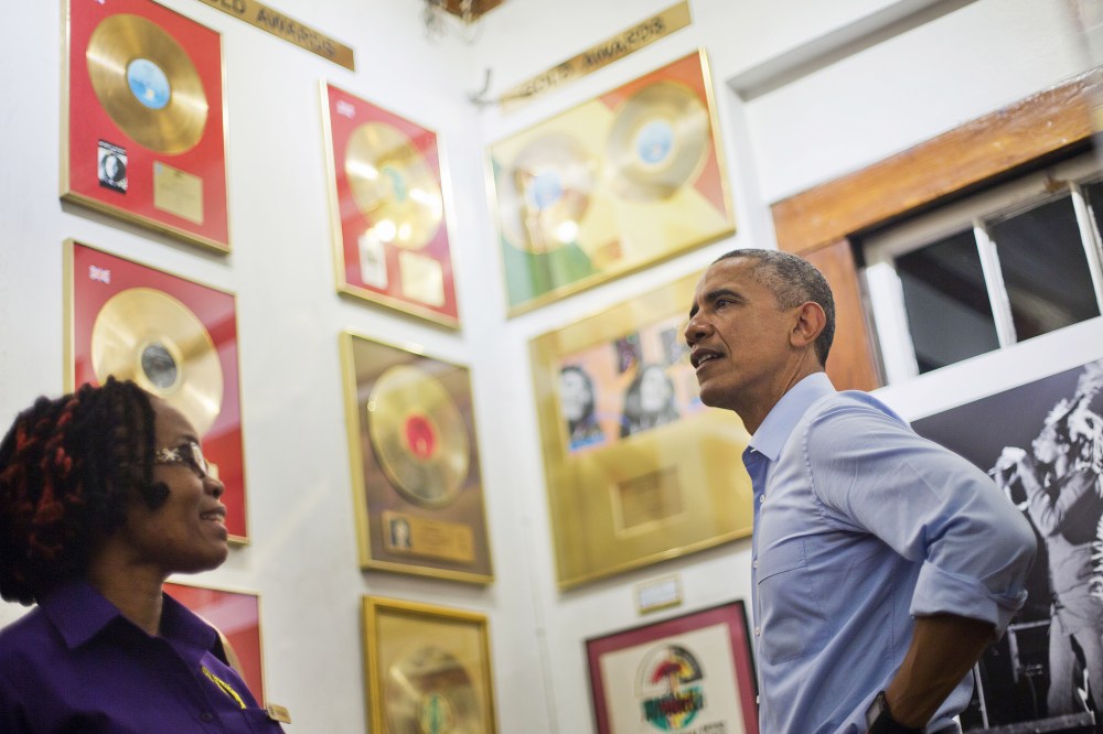 U.S. President Barack Obama, right, visits the Bob Marley Museum with tour guide Natasha Clark, left, April 8, 2015 in Kingston, Jamaica.