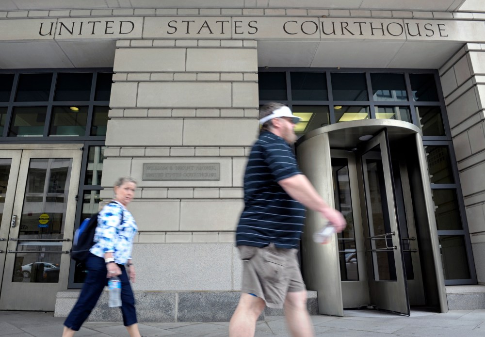 People walk in front of the U.S. Courthouse in Washington, Thursday, June 6, 2013, where the secret Foreign Intelligence Surveillance Court resides. An order was granted by the secret Foreign Intelligence Surveillance Court on April 25, good until July...