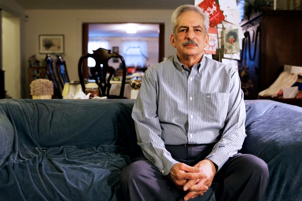 Stan Osnowitz, who lost his state unemployment benefits of $430 a week, poses in his living room in Baltimore, Jan. 10, 2014.