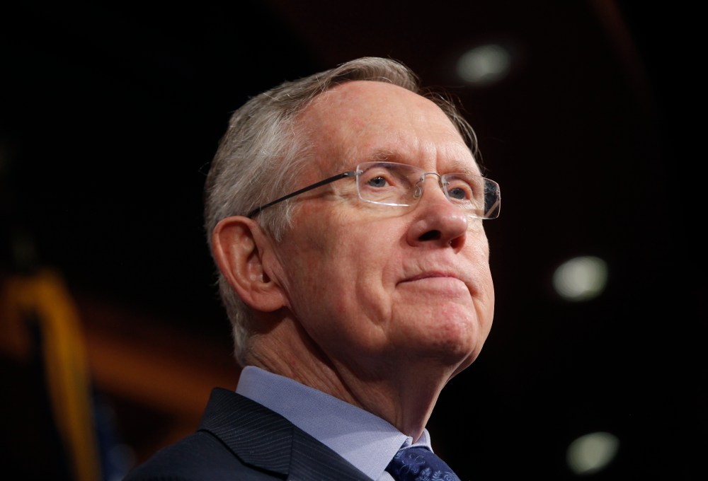 Senate Majority Leader Harry Reid of Nevada, listens to a reporter's question about their meeting with Senate Republicans regarding the government shutdown and debt ceiling on Capitol Hill in Washington on Saturday, Oct. 12, 2013.