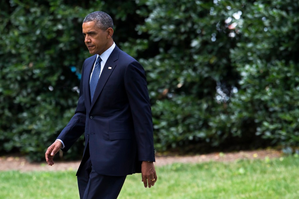 President Barack Obama walks on the South Lawn of the White House in Washington, D.C., June 26, 2014.