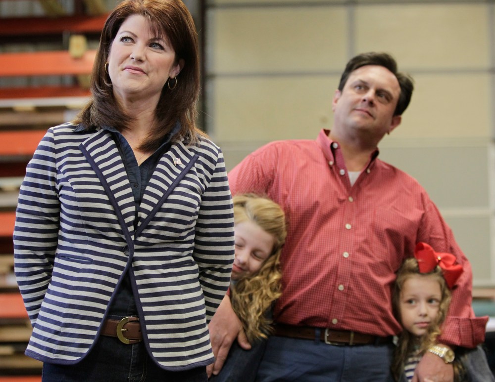 Wisconsin Lt. Gov. Rebecca Kleefisch and her family wait for their introduction at a campaign rally for Kleefisch and Gov. Scott Walker in Dane, Wis., April 15, 2014.
