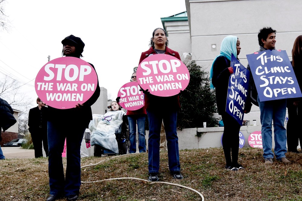 Abortion rights supporters stand outside the Jackson Women's Health Organization Inc., in Jackson, Miss., on Jan. 22, 2013.