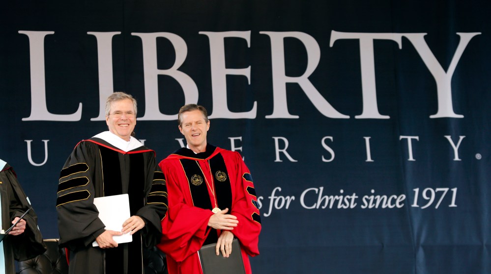 Former Florida Gov. Jeb Bush on stage with Liberty University president Jerry Falwell Jr. for commencement ceremonies in Williams Stadium in Lynchburg, Va., May 9, 2015. (Photo by Steve Helber/AP)