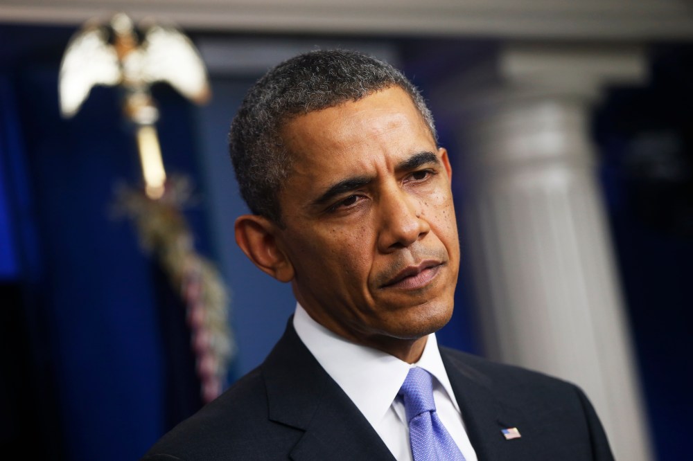 President Barack Obama listens to a question during his end-of-the-year news conference, Dec. 20, 2013.