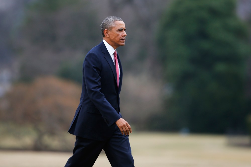 President Barack Obama walks on the South Lawn of the White House in Washington, Jan. 15, 2014.