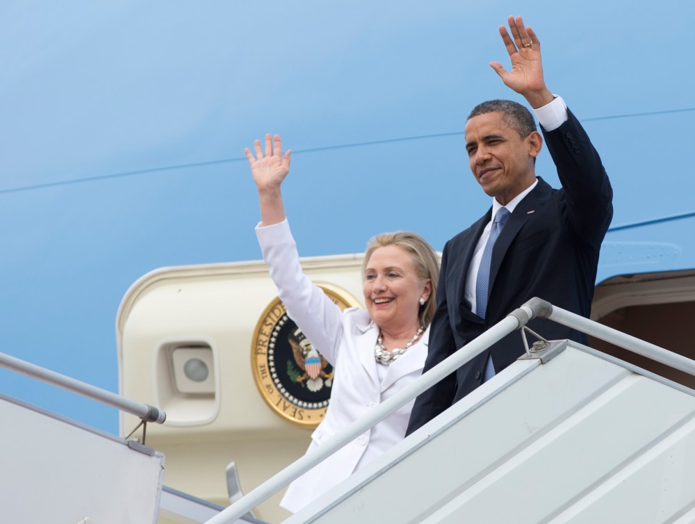 U.S. President Barack Obama and Secretary of State Hillary Rodham Clinton wave as they arrive at Yangon International Airport in Yangon, Myanmar. (Photo by Carolyn Kaster/AP)