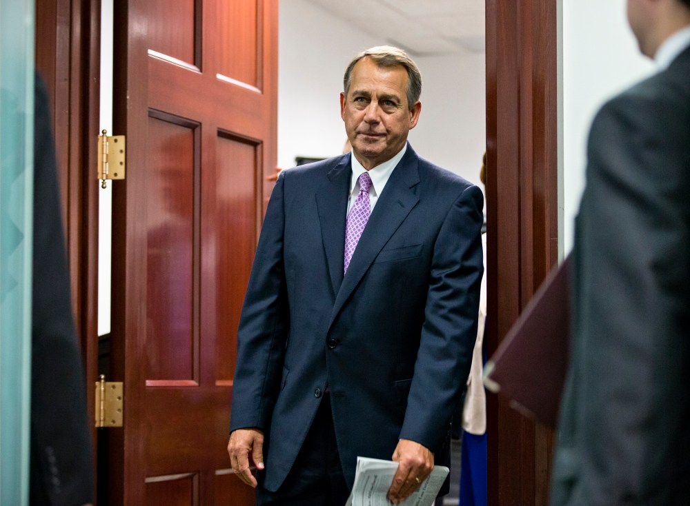 House Speaker John Boehner of Ohio and other members of the Republican Caucus emerge from a closed-door strategy session on Capitol Hill in Washington, Friday, Oct. 4, 2013.