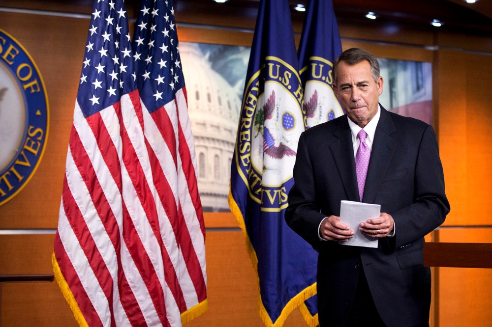 House Speaker John Boehner of Ohio leaves a news conference on Capitol Hill in Washington on Dec. 5, 2013.