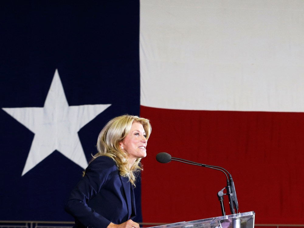 Sen. Wendy Davis speaks to supporter at a rally Thursday, Oct. 3, 2013, in Haltom City, Texas.