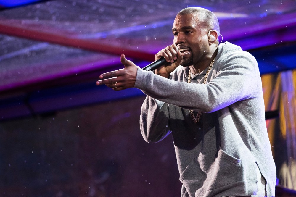 Kanye West performs in Times Square on Dec. 1, 2014 in New York, N.Y. (Photo by Charles Sykes/Invision/AP)
