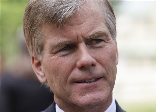 Virginia Gov. Bob McDonnell gestures as he answers reporters questions in  Richmond, Va., Monday, June 24, 2013. McDonnell answered questions on the new state laws taking effect July 1. (Photo by Steve Helber/AP)