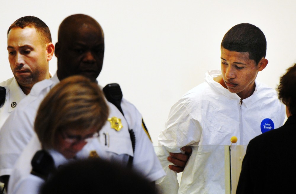 Philip Chism, 14, stands during his arraignment for the death of Danvers High School teacher Colleen Ritzer in Salem District Court in Salem, Mass., Wednesday, Oct. 23, 2013.
