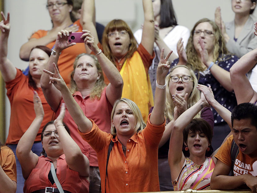 In this June 26, 2013 file photo, members of the gallery cheer and chant as the Texas Senate tries to bring an abortion bill to a vote as time expires, in Austin, Texas. (Photo by Eric Gay/AP)