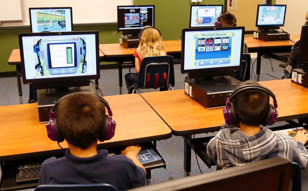 Students at Buchanan elementary school work in the computer lab in Oklahoma City, July 21, 2014. President Obama called Saturday for capping standardized testing at 2 percent of classroom time. (Photo by Sue Ogrocki/AP)