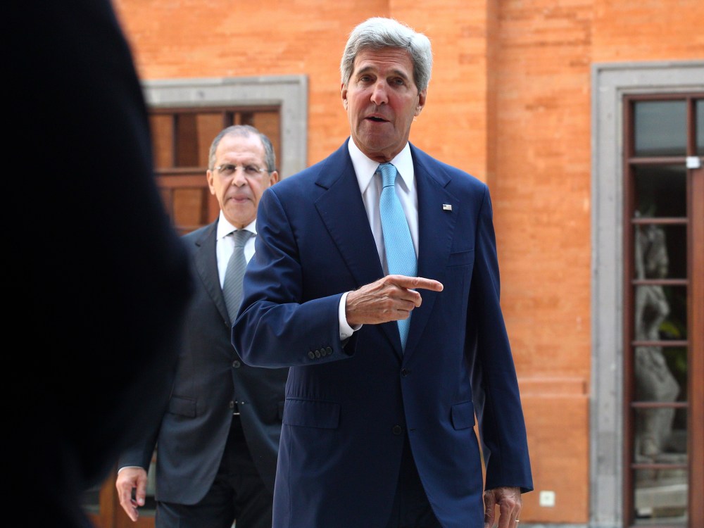 U.S. Secretary of State John Kerry gestures as he walks followed by Russian Foreign Minister Sergey Lavrov for a bilateral meeting on the sidelines of the Asia-Pacific Economic Cooperation (APEC) summit in Bali, Indonesia, Monday, Oct. 7, 2013.