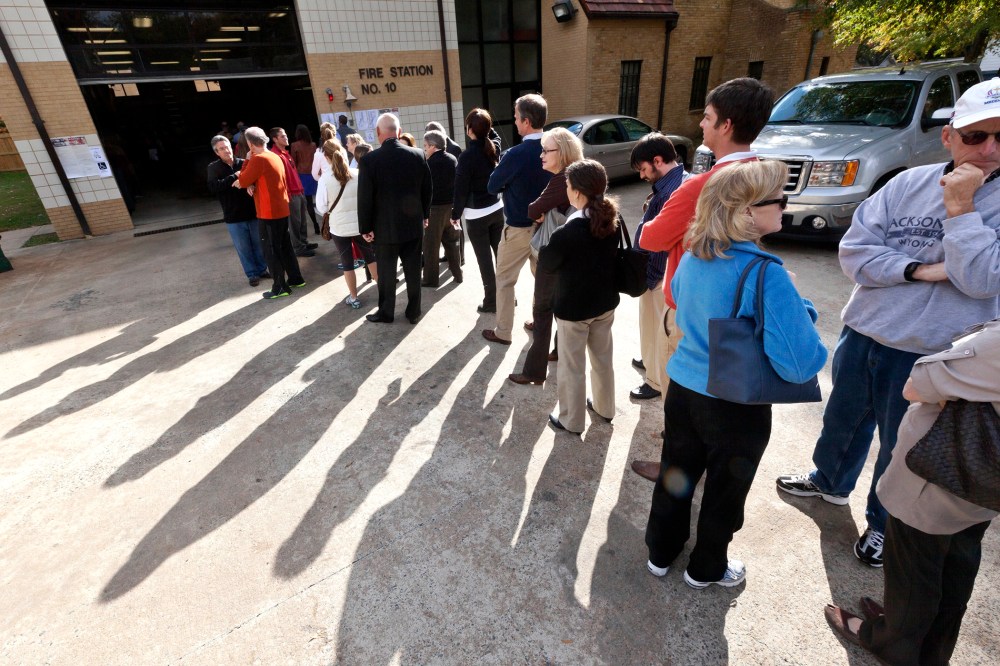 Voters wait in line outside a fire station being used as a polling place in Little Rock, Ark., on Nov. 6, 2012.