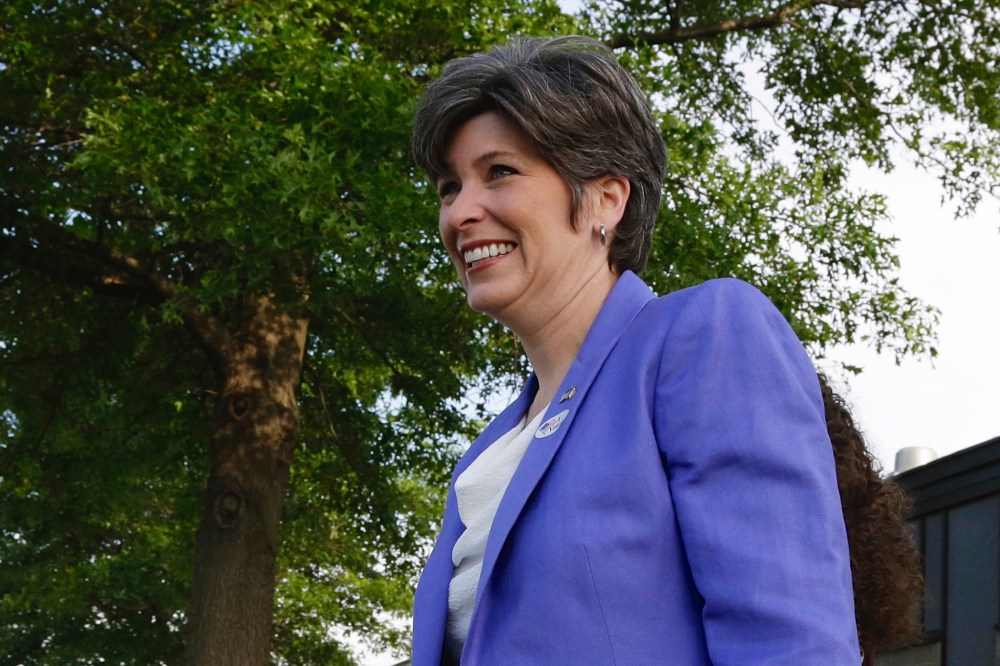 Republican U.S. Senate candidate Joni Ernst leaves the polling station after casting her ballot in Iowa'­s Republican primary in Red Oak, Iowa, June 3, 2014.