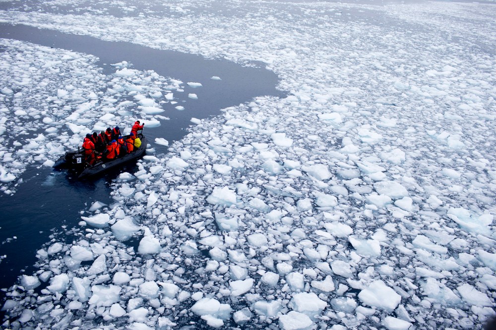 In this Jan. 22, 2015 photo, a zodiac carrying a team of international scientists heads to Chile's station Bernardo O'Higgins, Antarctica. (Photo by Natacha Pisarenko/AP)