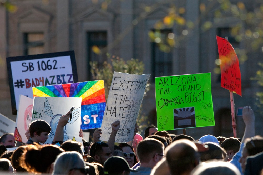 Opponents of the SB1062, a religious freedom bill, urged Gov. Brewer to veto the bill during a protest rally at the state Capitol, Feb. 21, 2014.