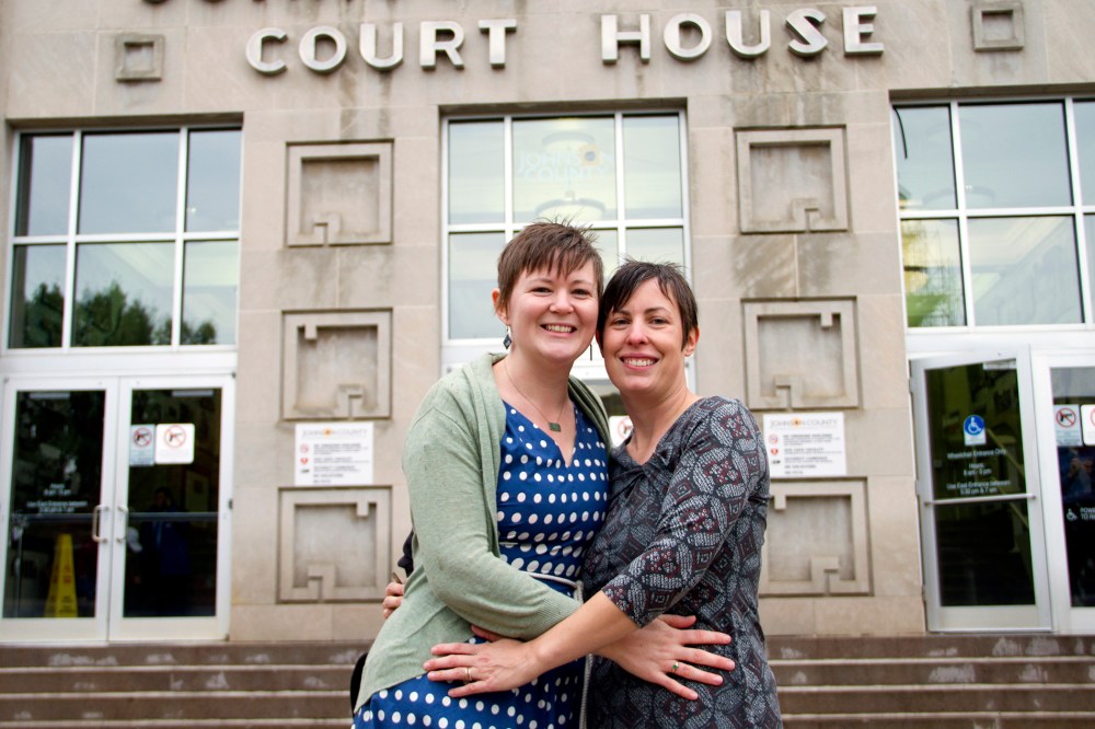 In this photo provided by Liz Dickinson, Kelli, left, and Angela pose for a picture after their wedding ceremony at the Johnson County Court House in Olathe, Kan., Friday, Oct. 10, 2014. (Liz Dickinson-Snyder/piperlucyphotography.org/AP)