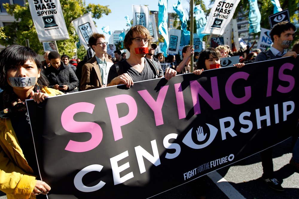 Demonstrators March through Washington towards the National Mall to rally and demand that the U.S. Congress investigate the National Security Agency's mass surveillance programs Saturday, Oct. 26, 2013.