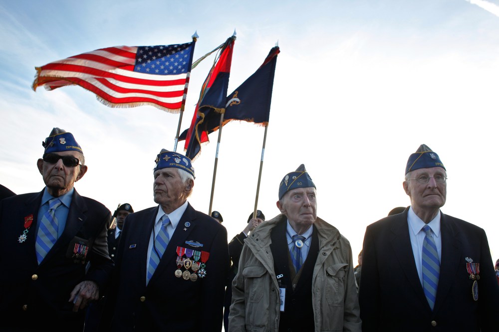 From left, World War II veterans of the U.S. 29th Infantry Division, Hal Baumgarten, 90 from Pennsylvania, Steve Melnikoff, 94, from Maryland, Don McCarthy, 90 from Rhode Island, and Morley Piper, 90, from Massachusetts, attend a D-Day commemoration, on O