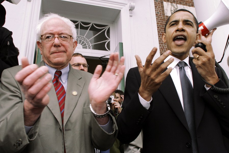 In this March 10, 2006, file photo, Barack Obama speaks at a Democratic rally for then U.S. Rep. Bernie Sanders in Burlington, Vt. (Photo by Toby Talbot/AP)