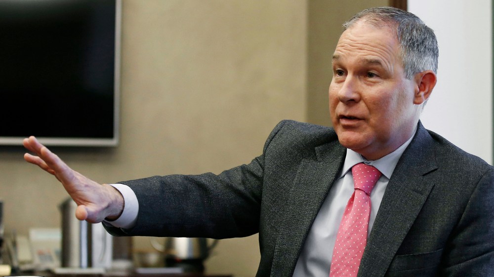 In this March 10, 2016 photo, Scott Pruitt, Oklahoma Attorney General, gestures as he speaks during an interview in Oklahoma City, Okla. (Photo by Sue Ogrocki/AP)