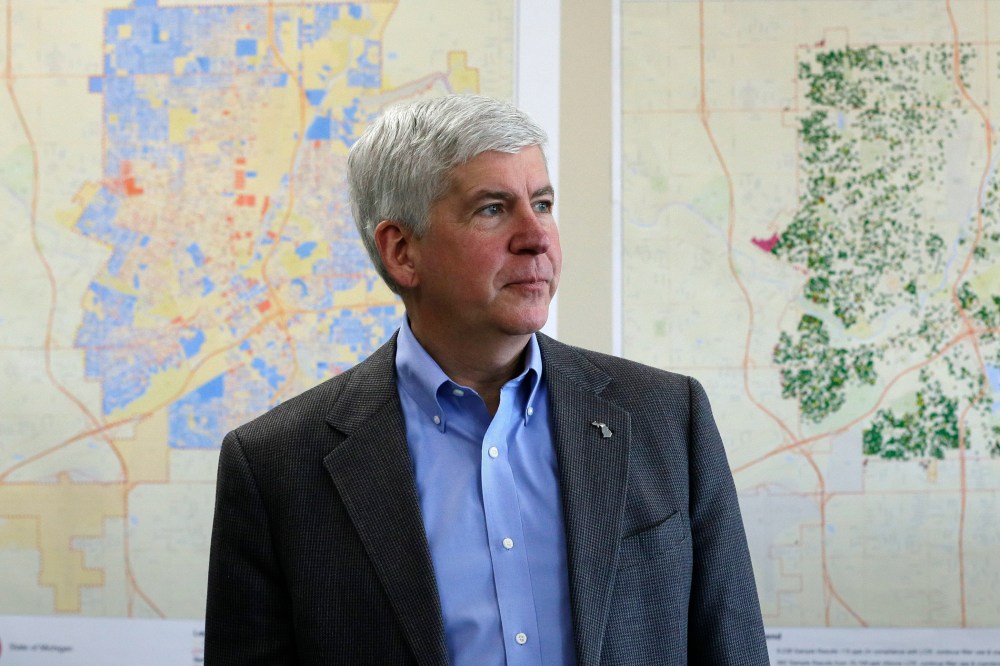 In this Feb. 18, 2016 file photo, Gov. Rick Snyder addresses the media in Flint, Mich. (Photo by Carlos Osorio/AP)