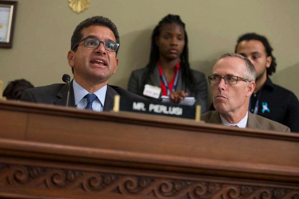 Rep. Jared Huffman, D-Calif. listens at right as Puerto Rico's Resident Commission Pedro Pierluisi, D-Puerto Rico, speaks on Capitol Hill in Washington, May 25, 2016. (Photo by Evan Vucci/AP)