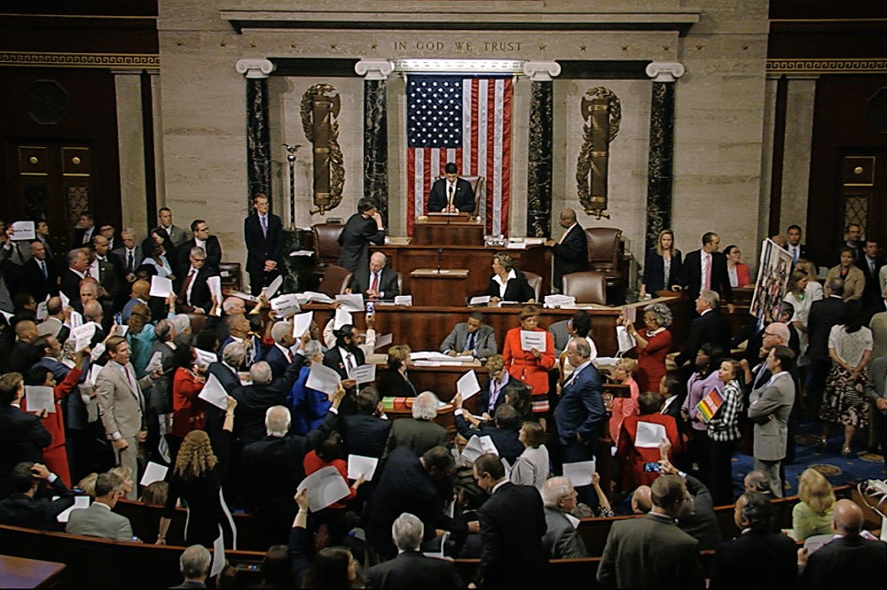 In this image from video provided by House Television, House Speaker Paul Ryan stands at the podium as he brings the House into session in the night of June 22, 2016, in Washington. (Photo by House Television/AP)