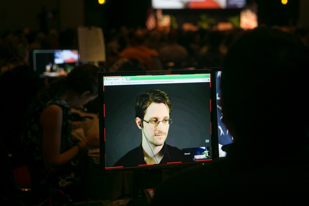 A video technician monitors a computer screen as Edward Snowden appears on a live video feed broadcast from Moscow at an event sponsored by the ACLU Hawaii in Honolulu on Feb. 14, 2015. (Photo by Marco Garcia/AP)