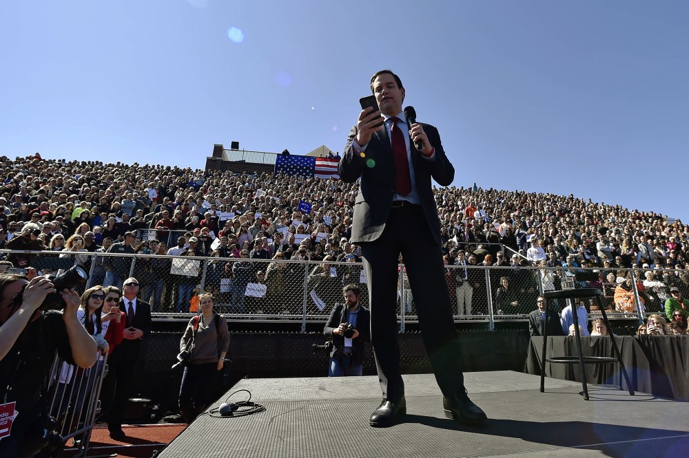 Republican presidential candidate, Sen. Marco Rubio, R-Fla., reads from his phone at Mount Paran Christian School, Feb. 27, 2016, in Kennesaw, Ga. (Photo by Mike Stewart/AP)