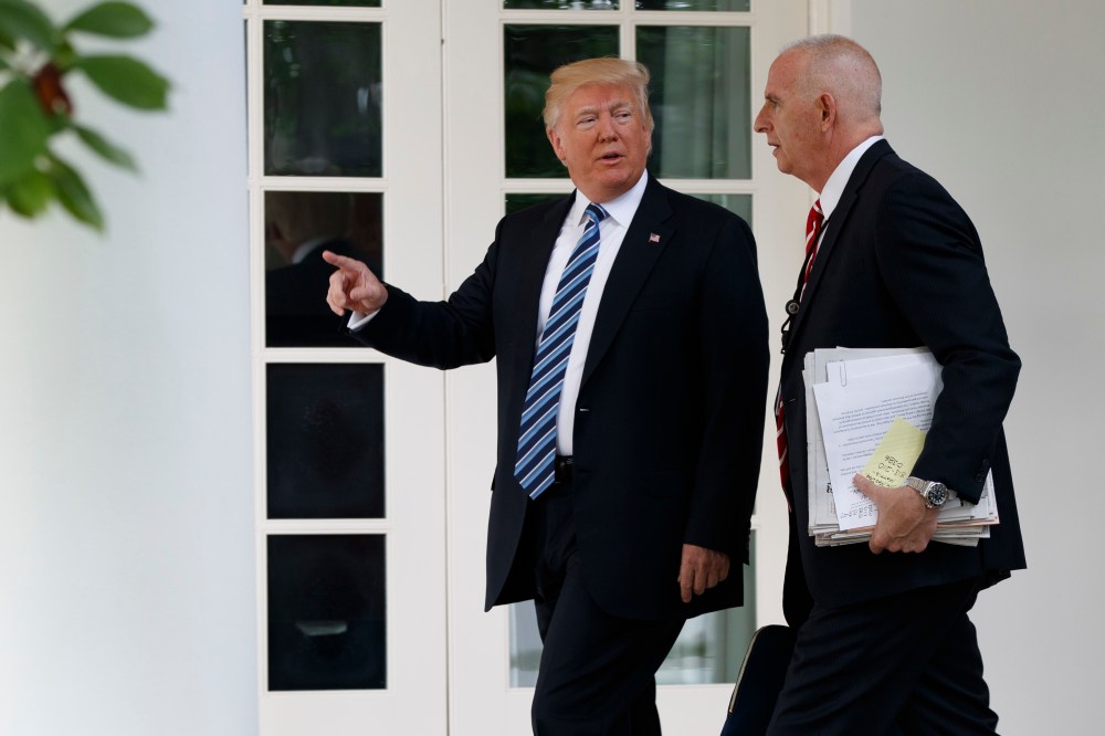 In a Tuesday, May 2, 2017 file photo, President Donald Trump walks with aide Keith Schiller to the Oval Office of the White House in Washington.