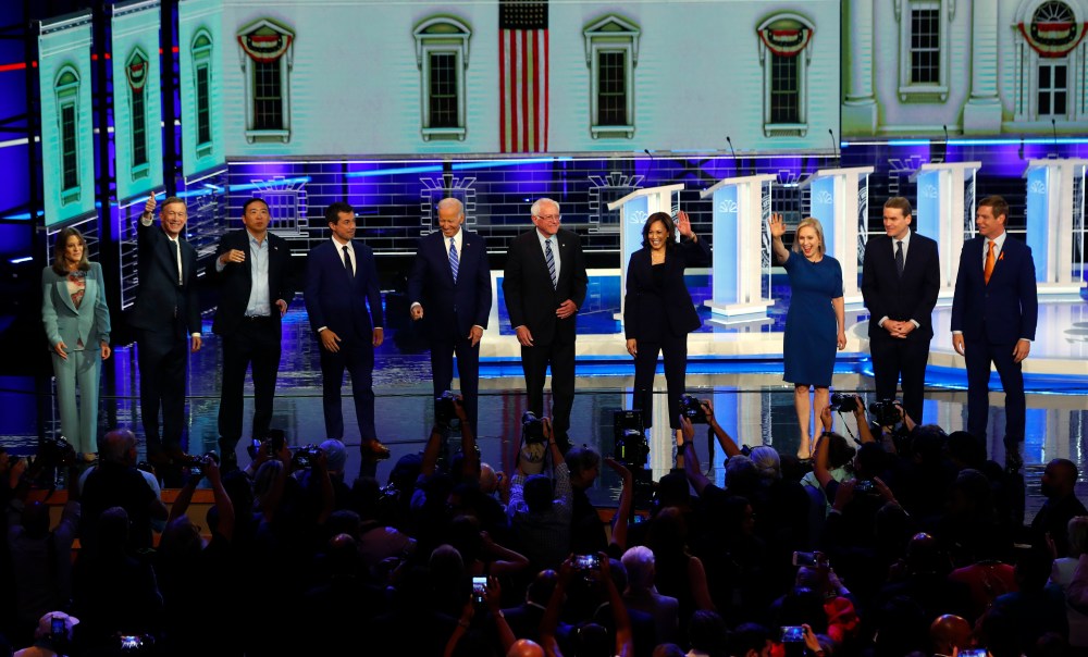 Democratic presidential candidates wave as they enter the stage for the second night of the Democratic primary debate hosted by NBC News at the Adrienne Arsht Center for the Performing Arts, Thursday, June 27, 2019, in Miami.