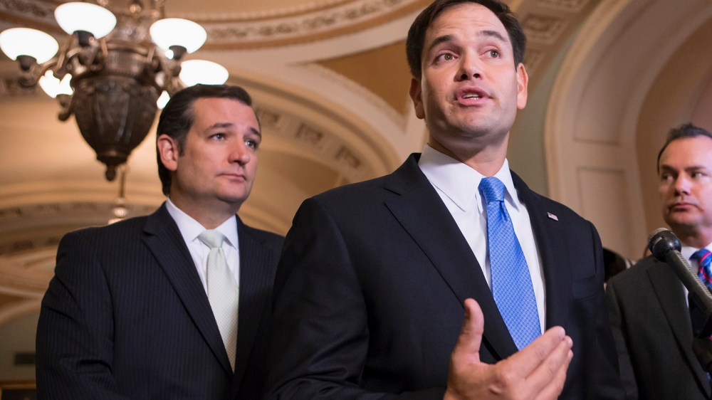 Sen. Marco Rubio, R-Fla., accompanied by Sen. Ted Cruz, R-Texas, speaks during a news conference on Capitol Hill in Washington, Sept. 27, 2013. (Photo by J. Scott Applewhite/AP)