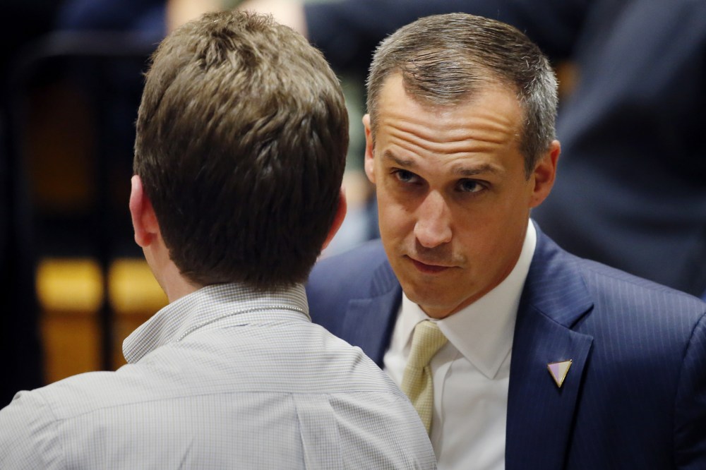 In this photo taken April 3, 2016, Corey Lewandowski talks to a member of the media at Nathan Hale High School in West Allis, Wis. (Photo by Charles Rex Arbogast/AP)