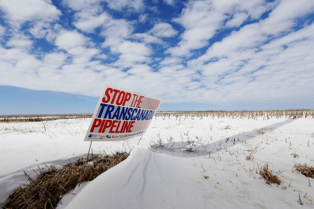 In this March 11, 2013, file photo, a sign reading "Stop the Transcanada Pipeline" stands in a field near Bradshaw, Neb. (Photo by Nati Harnik/AP)
