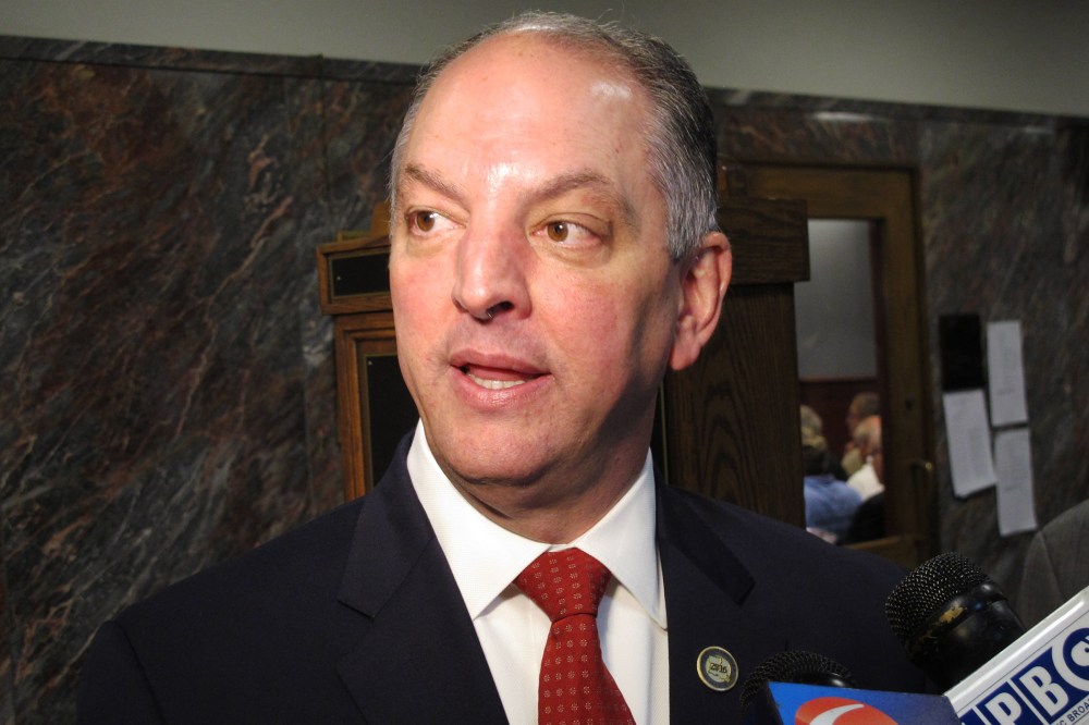 Louisiana Gov. John Bel Edwards talks with reporters about his budget cut proposal for the upcoming fiscal year after speaking to the House Appropriations Committee, April 12, 2016, in Baton Rouge, La. (Photo by Melinda Deslatte/AP)