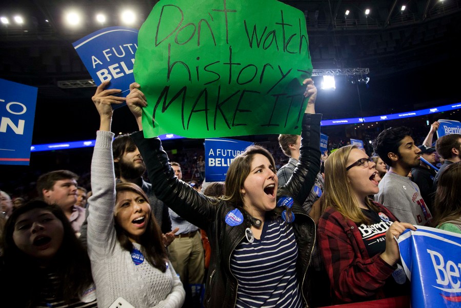 Supporters of Democratic presidential candidate Sen. Bernie Sanders, I-Vt., cheer during a rally, Feb. 21, 2016, in Greenville, S.C. (Photo by John Bazemore/AP)