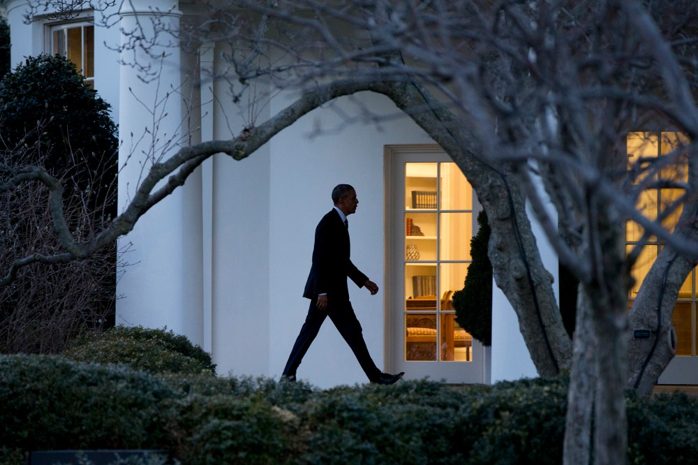 President Barack Obama walks to the Oval Office if the White House in Washington, D.C., Feb. 26, 2016. (Photo by Carolyn Kaster/AP)