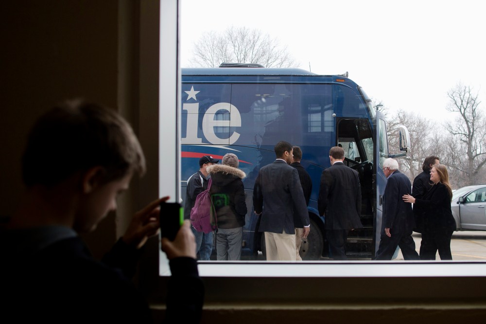 Harrison Pearce, 13, takes pictures of Democratic presidential candidate Sen. Bernie Sanders (I-Vt.) after a campaign event, Jan. 25, 2016, in Iowa Falls, Iowa. (Photo by Jae C. Hong/AP)