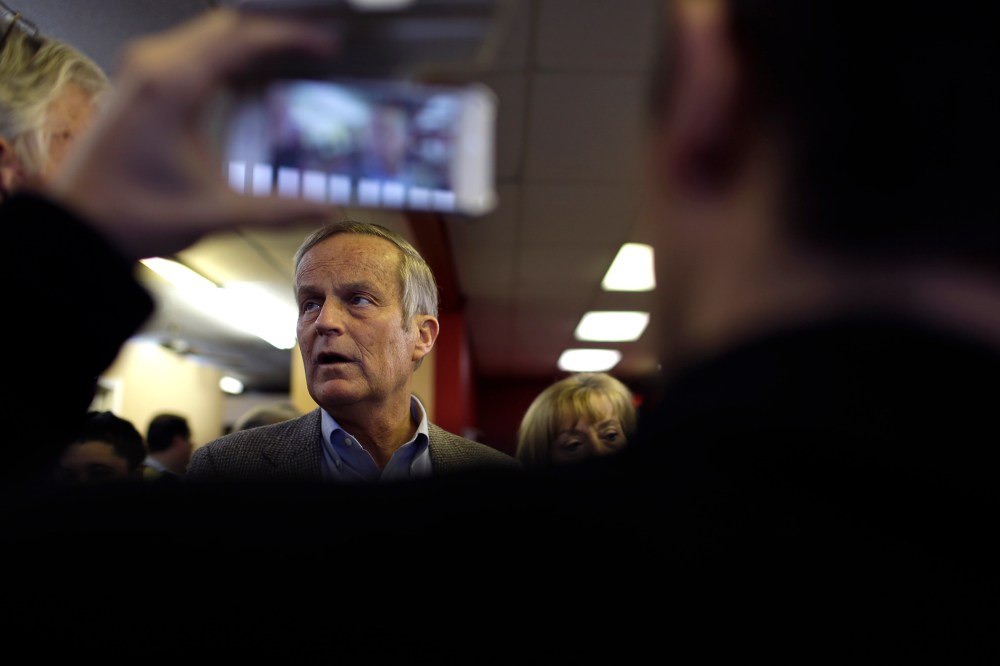 Then, Missouri Senate candidate, Rep. Todd Akin, R-Mo., visits with supporters during a stop to a Republican campaign office, Nov. 5, 2012, in Florissant, Mo. (Photo by Jeff Roberson/AP)