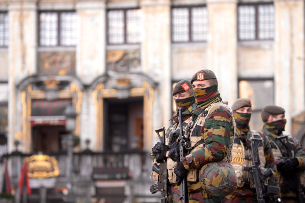 Soldiers and police patrol the city center in Brussels on Nov. 23, 2015. (Photo by Jakub Dospiva/CTK/AP)