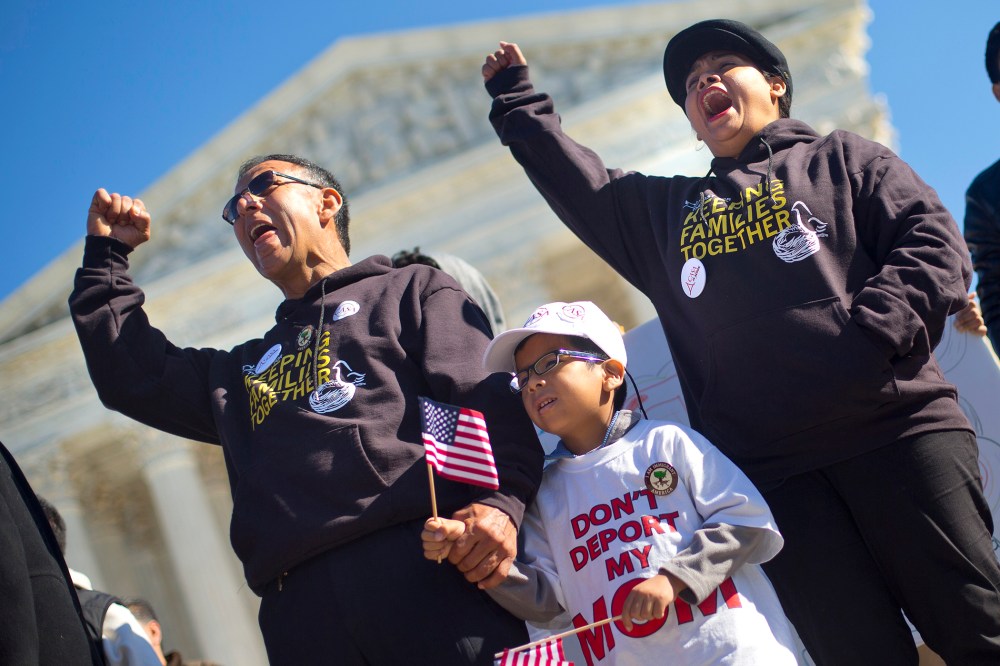 Six-year-old Michael Claros, center, joins his parents during a rally for immigration reform, Nov. 20, 2015, at the Supreme Court in Washington. (Photo by Pablo Martinez Monsivais/AP)