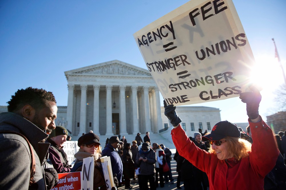 Protesters rally outside of the Supreme Court in Washington, Jan. 11, 2016, as the court heard arguments in the 'Friedrichs v. California Teachers Association' case. (Photo by Jacquelyn Martin/AP)