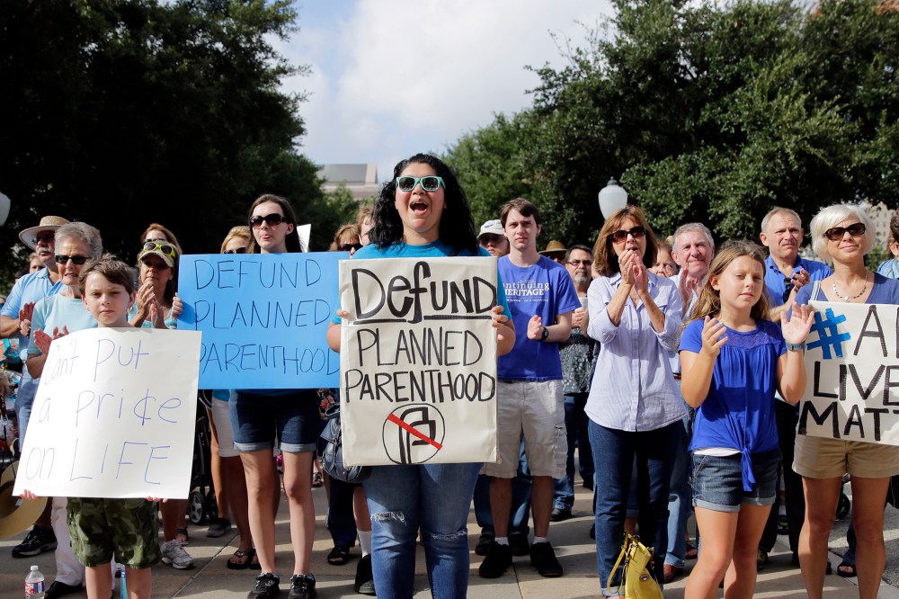 Anti-abortion activists rally on the steps of the Texas Capitol to condemn the use in medical research of tissue samples from aborted fetuses, on July 28, 2015, in Austin, Texas. (hoto by Eric Gay/AP).